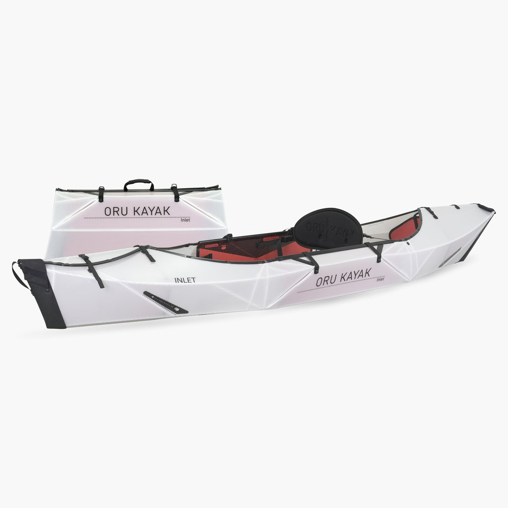 Side view of the Oru Kayak Inlet model in white, shown fully assembled in front of its compact folded box form.