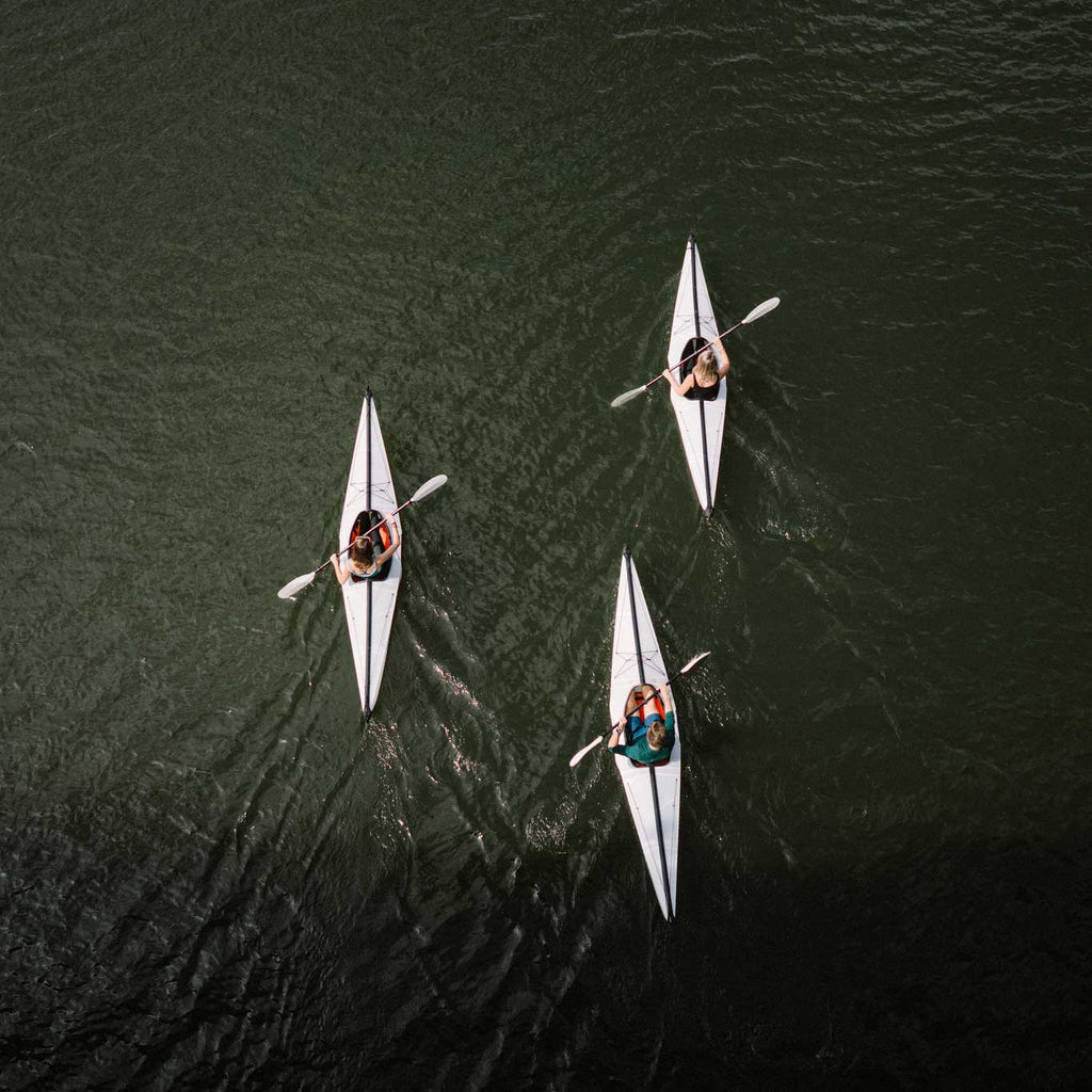 People paddling on their bay St kayak on the river