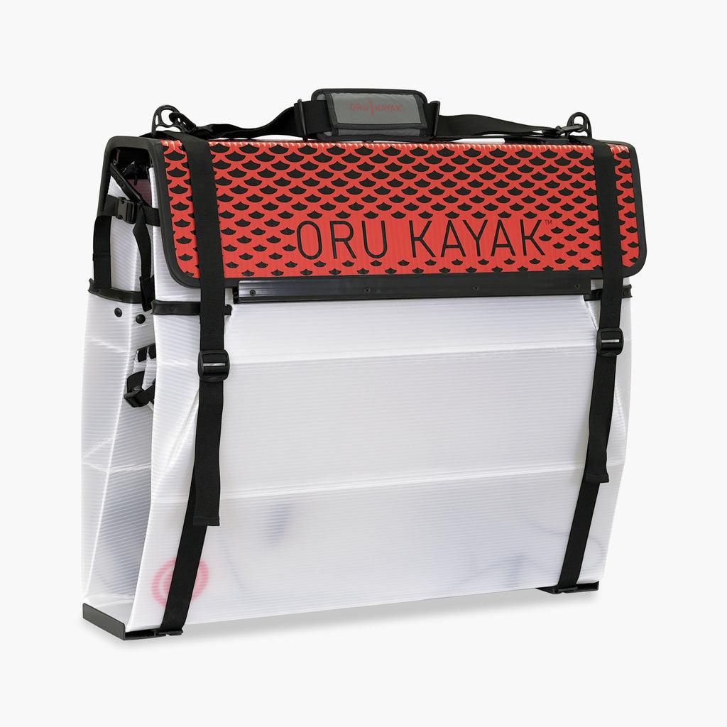 Side folded white Oru Kayak Beach Sport model in white in box form.