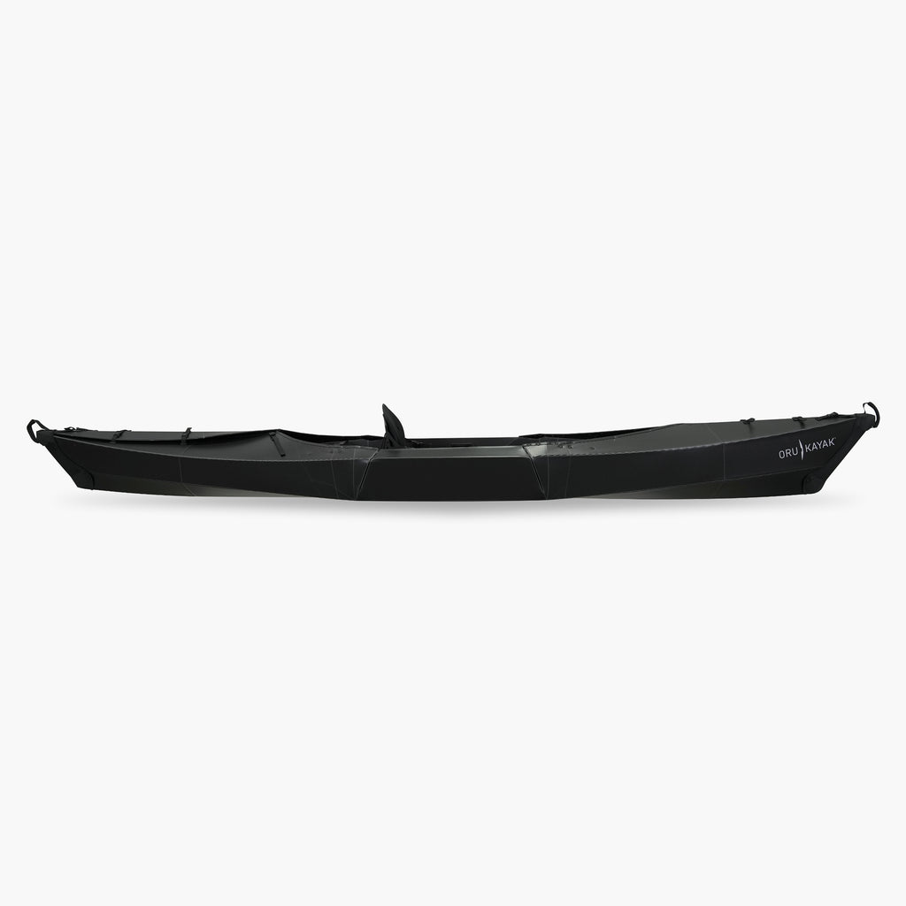 Side view of the Oru Kayak Beach model in black.