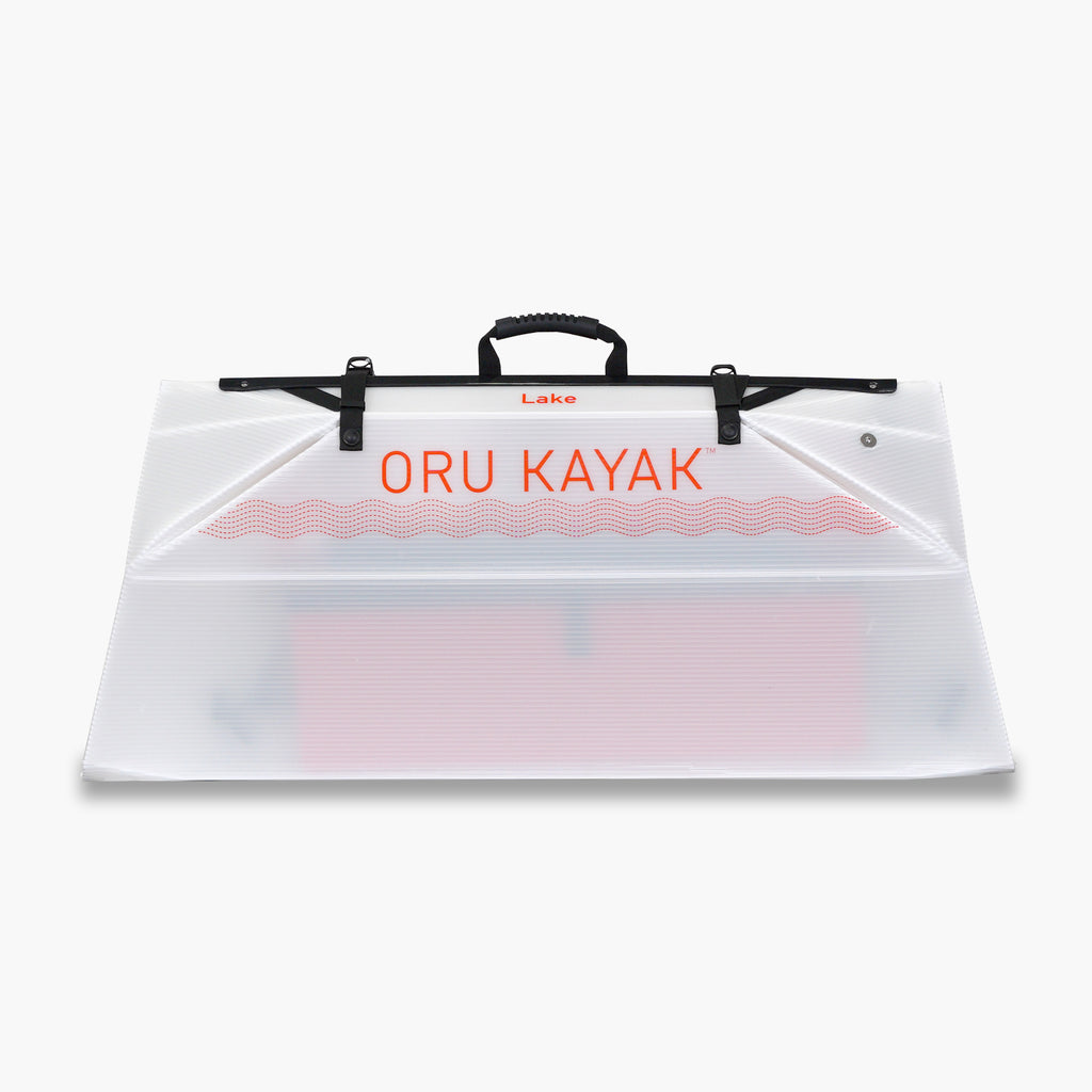 Folded white Oru Kayak Lake Sport model in white in box form.