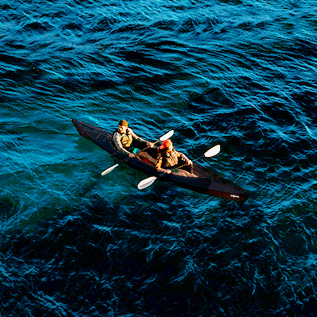 2 people and dog kayaking on a haven tt kayak black edition