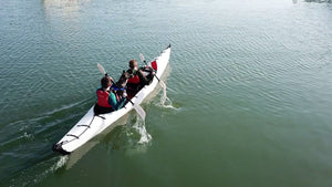 2 people and dog kayaking on a haven tt kayak