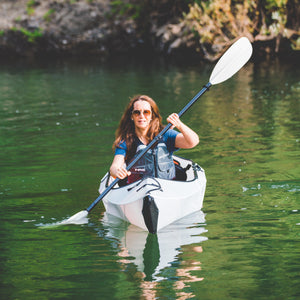 Woman kayaking on her inlet kayak 