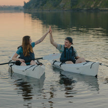 2 people paddling on their lake kayak