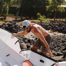 man assembling beach lt kayak 
