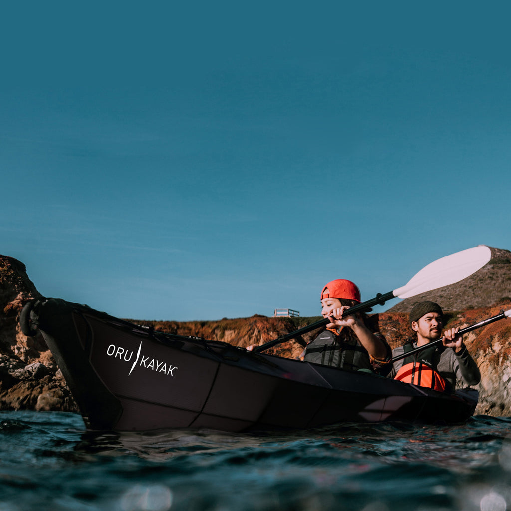 2 people and dog kayaking on a haven tt kayak black edition